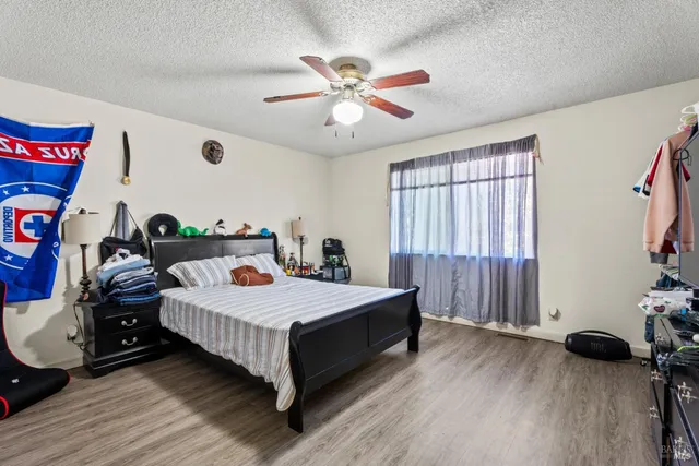 a view of a backyard with sitting area