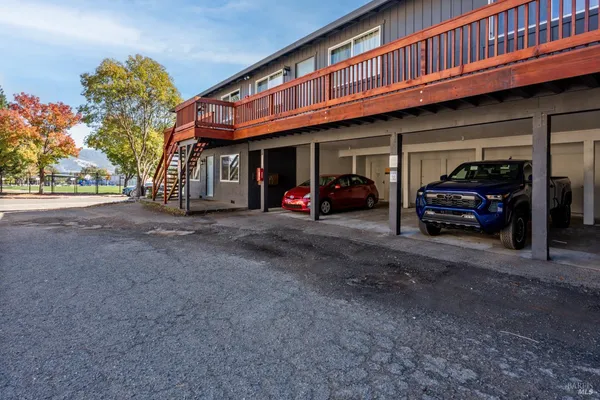 a view of a car parked in front of a house