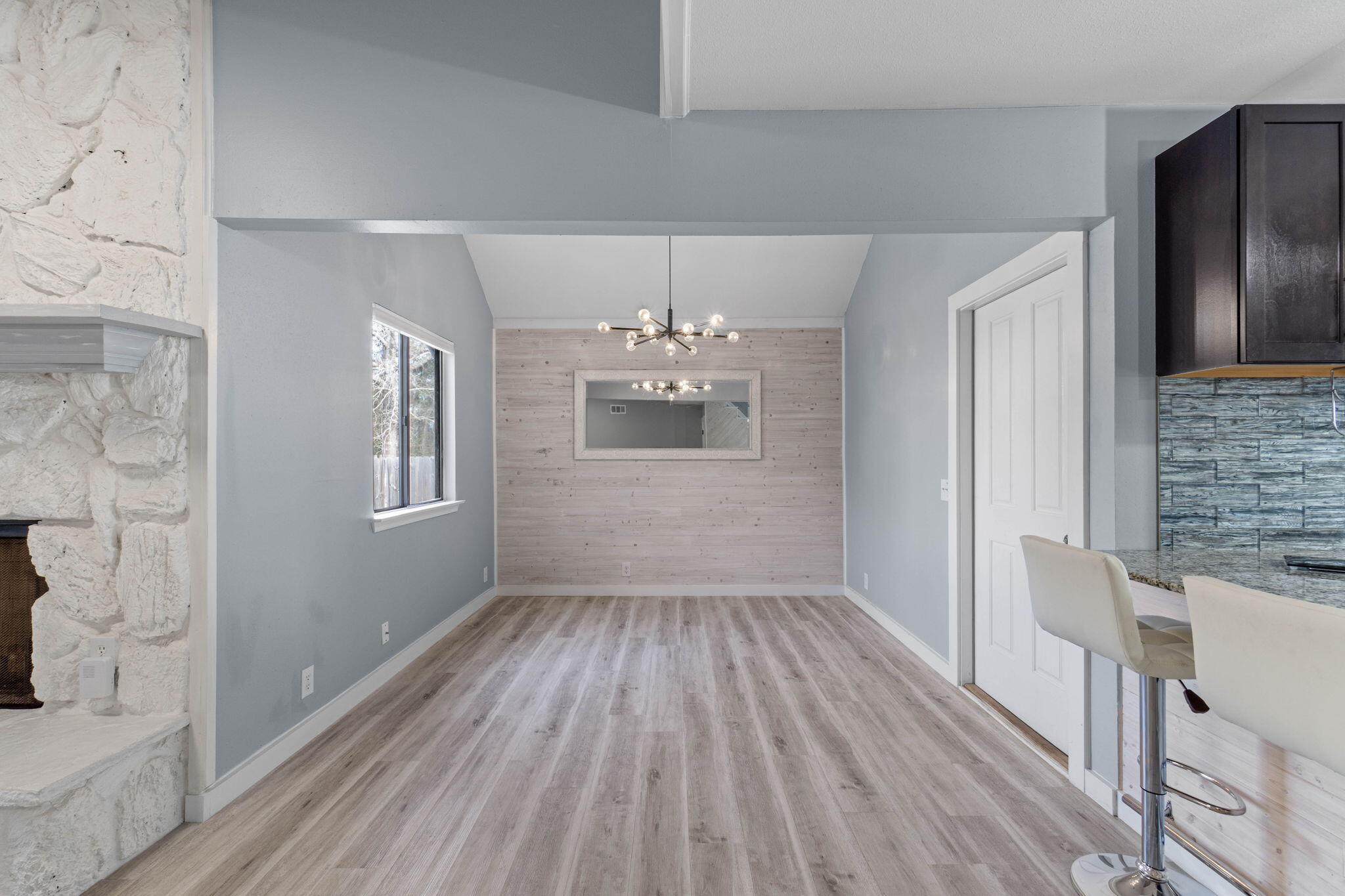41 Solar Street Mary Esther, FL 32569 - Photo 12 of 40 a view of kitchen and hallway with wooden floor