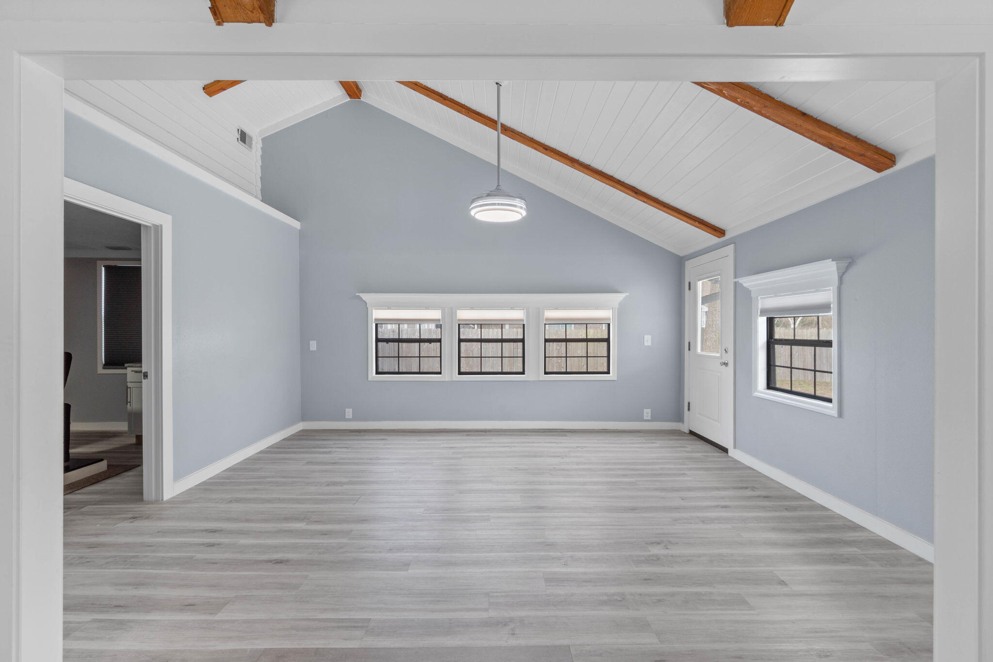 41 Solar Street Mary Esther, FL 32569 - Photo 18 of 40 a view of an empty room with wooden floor and a window