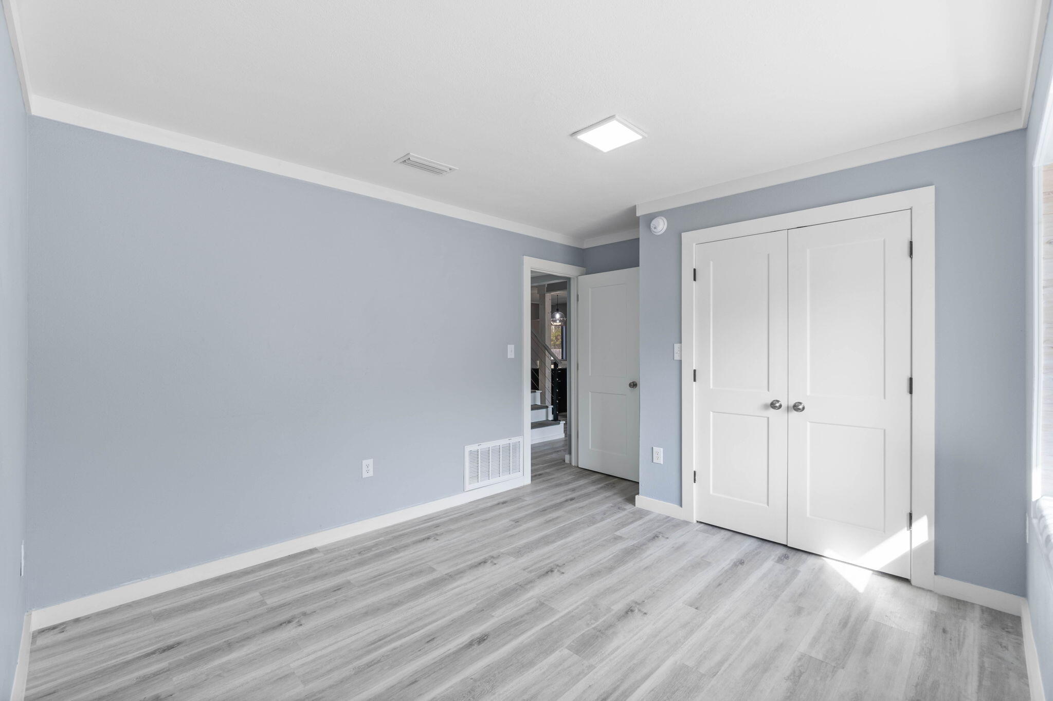 41 Solar Street Mary Esther, FL 32569 - Photo 22 of 40 a view of an empty room with wooden floor