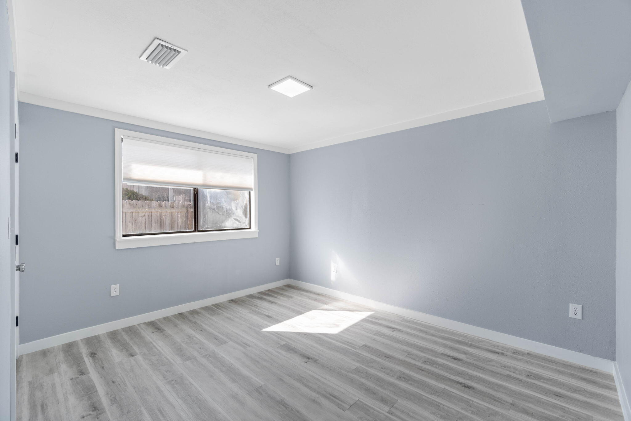 41 Solar Street Mary Esther, FL 32569 - Photo 23 of 40 wooden floor in an empty room with a window