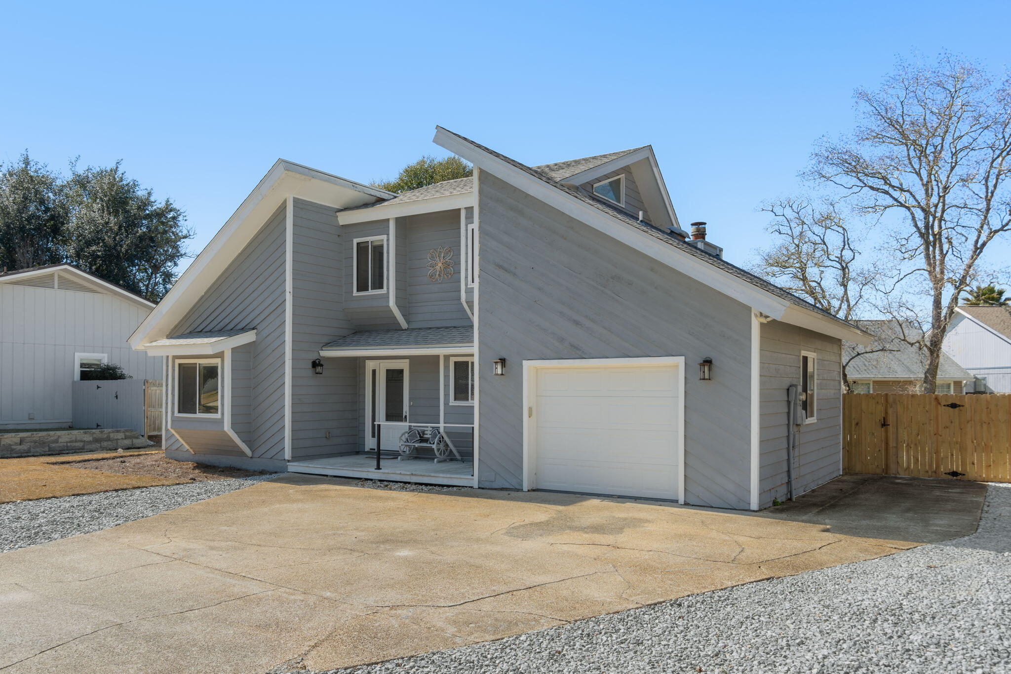 41 Solar Street Mary Esther, FL 32569 - Photo 3 of 40 a front view of house with yard and trees in the background