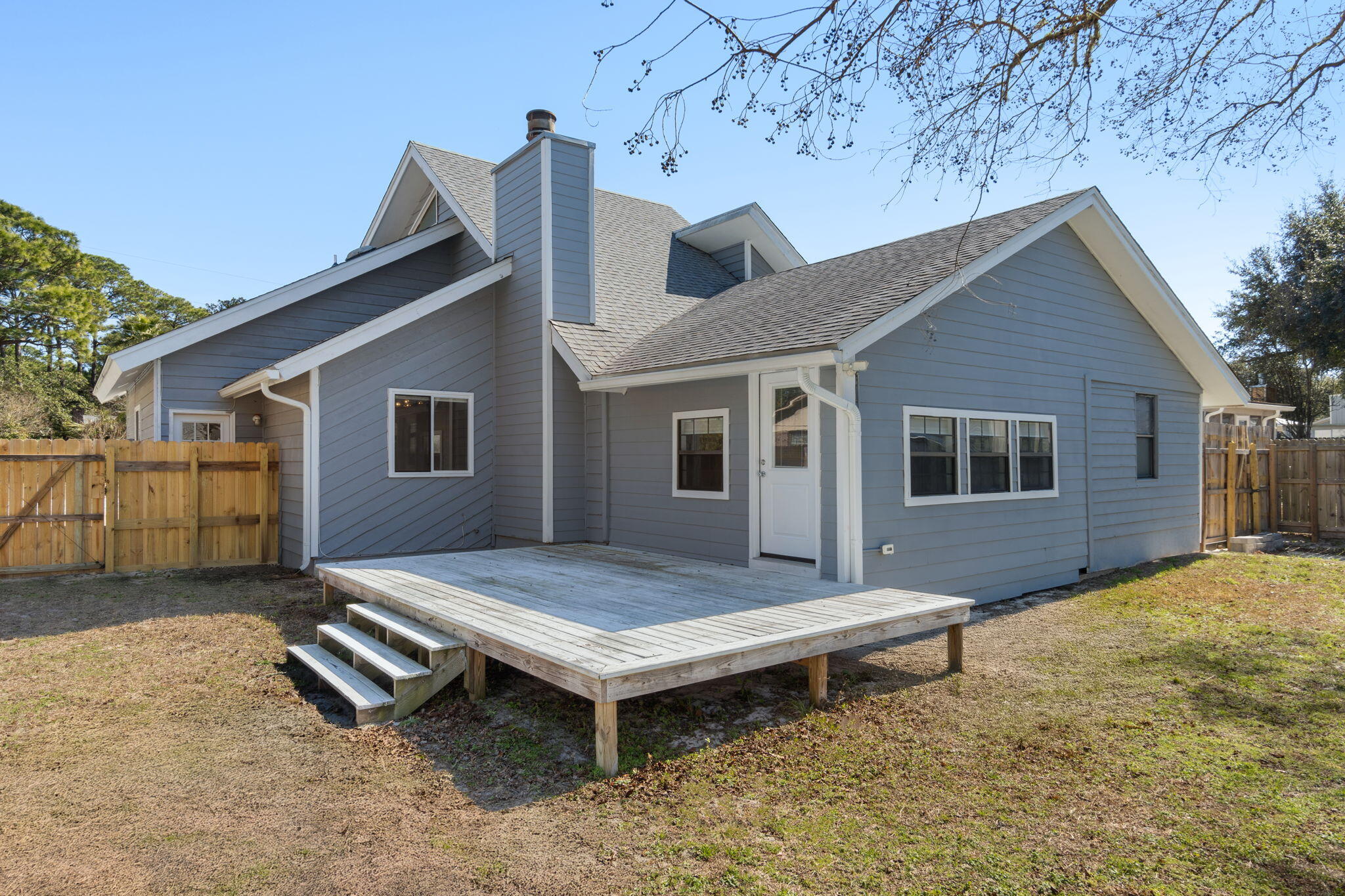 41 Solar Street Mary Esther, FL 32569 - Photo 37 of 40 a backyard of a house with table and chairs