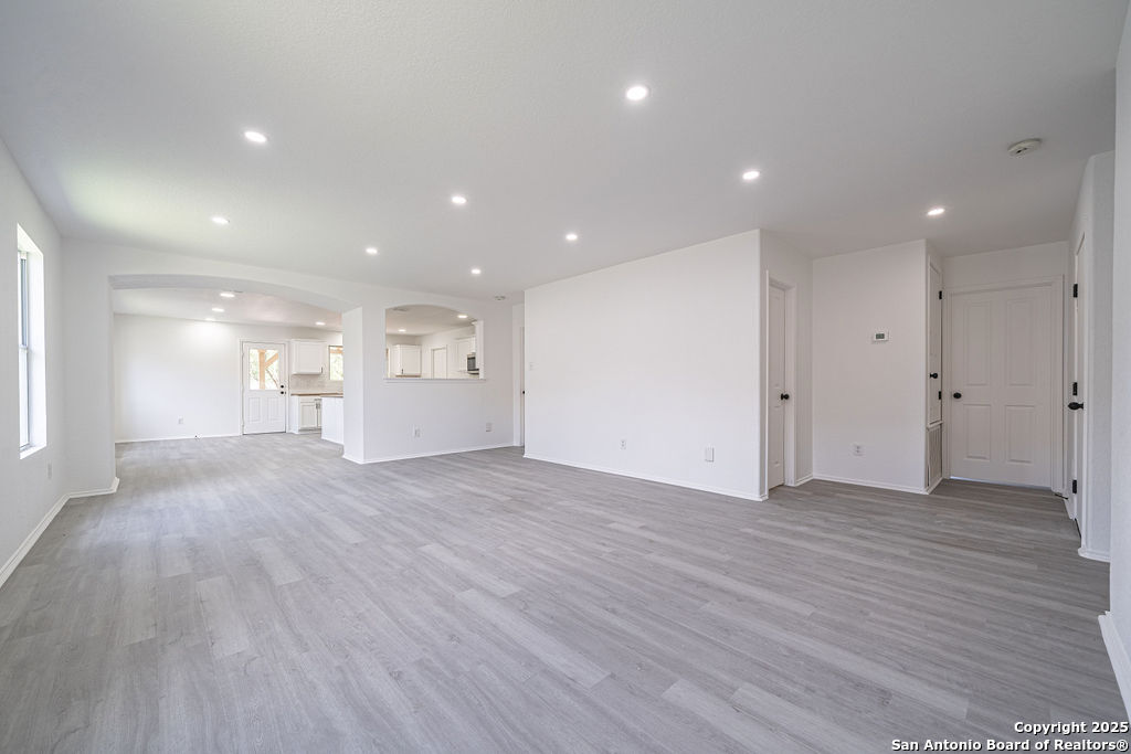 3914 Cinco Rios San Antonio, TX 78223 - Photo 2 of 12 a view of empty room with wooden floor