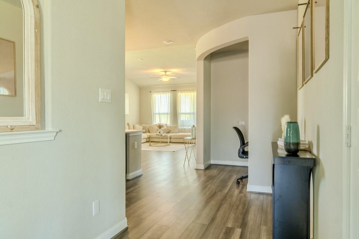 2617 Indigo Harvest Trail Pearland, TX 77089 - Photo 11 of 32 a view of a living room with a wooden floor