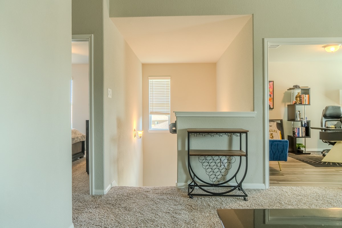 2617 Indigo Harvest Trail Pearland, TX 77089 - Photo 19 of 32 Staircase has windows for added natural light.