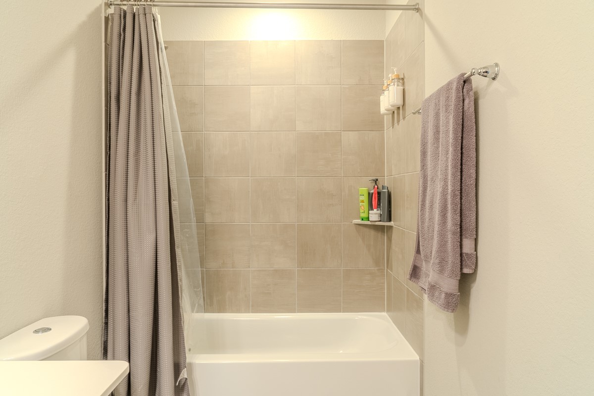 2617 Indigo Harvest Trail Pearland, TX 77089 - Photo 22 of 32 a bathroom with a shower and a toilet