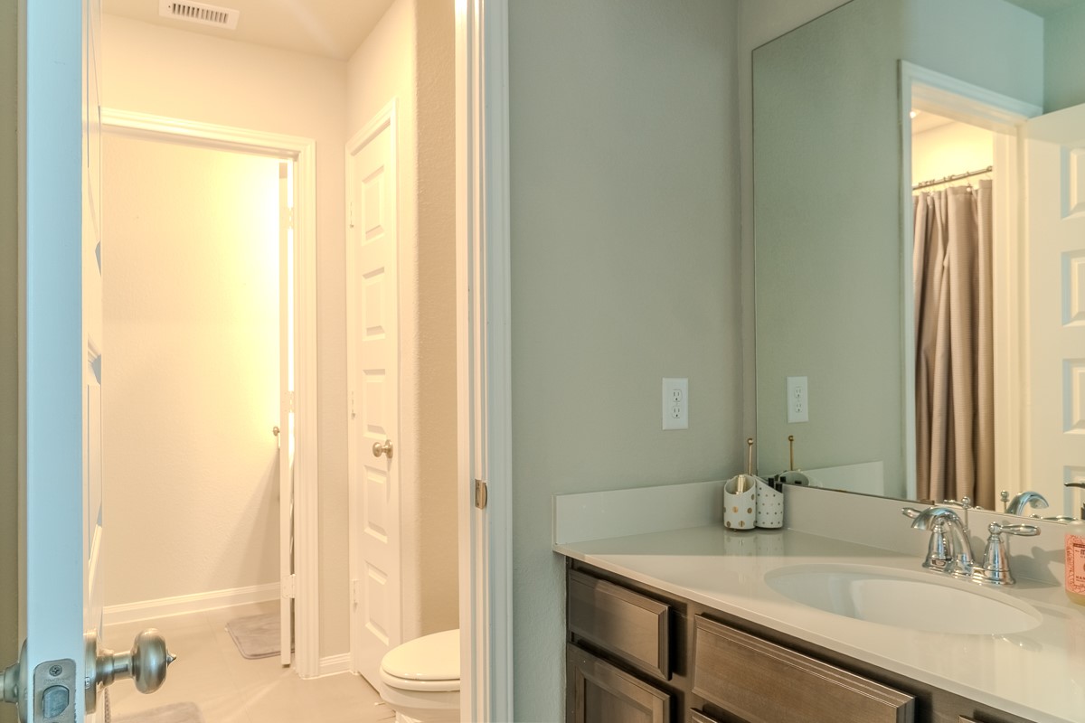2617 Indigo Harvest Trail Pearland, TX 77089 - Photo 23 of 32 a bathroom with a granite countertop sink toilet and shower