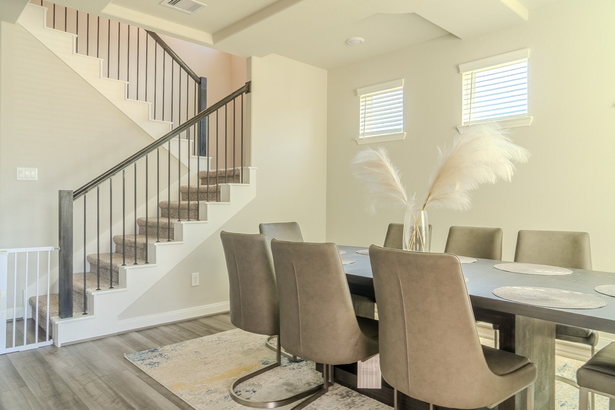 2617 Indigo Harvest Trail Pearland, TX 77089 - Photo 7 of 32 a view of a dining room with furniture window and wooden floor