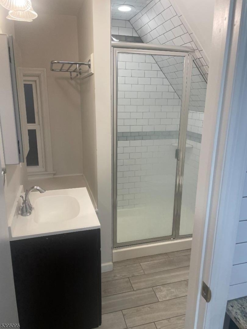 38 Morris Avenue, Unit 3 Springfield, NJ 07081 - Photo 2 of 12 a bathroom with a sink and shower