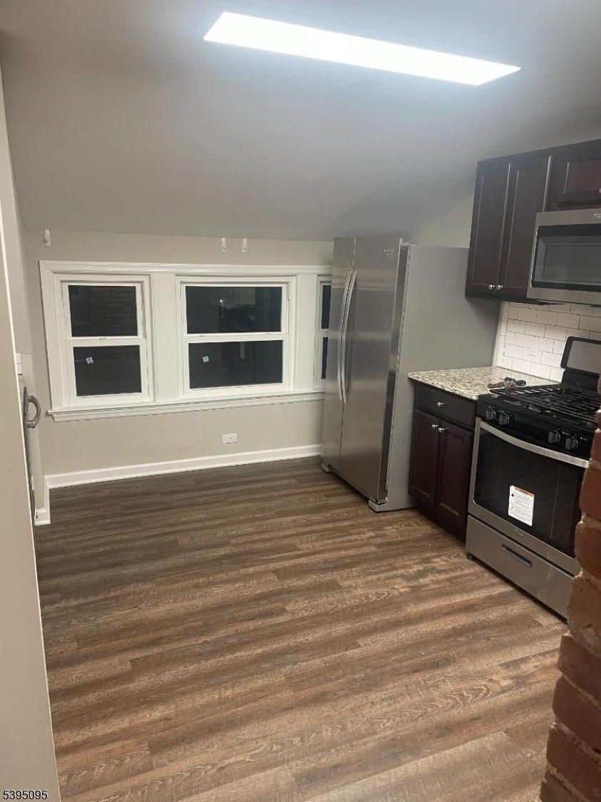 38 Morris Avenue, Unit 3 Springfield, NJ 07081 - Photo 3 of 12 a view of an empty room with kitchen and window