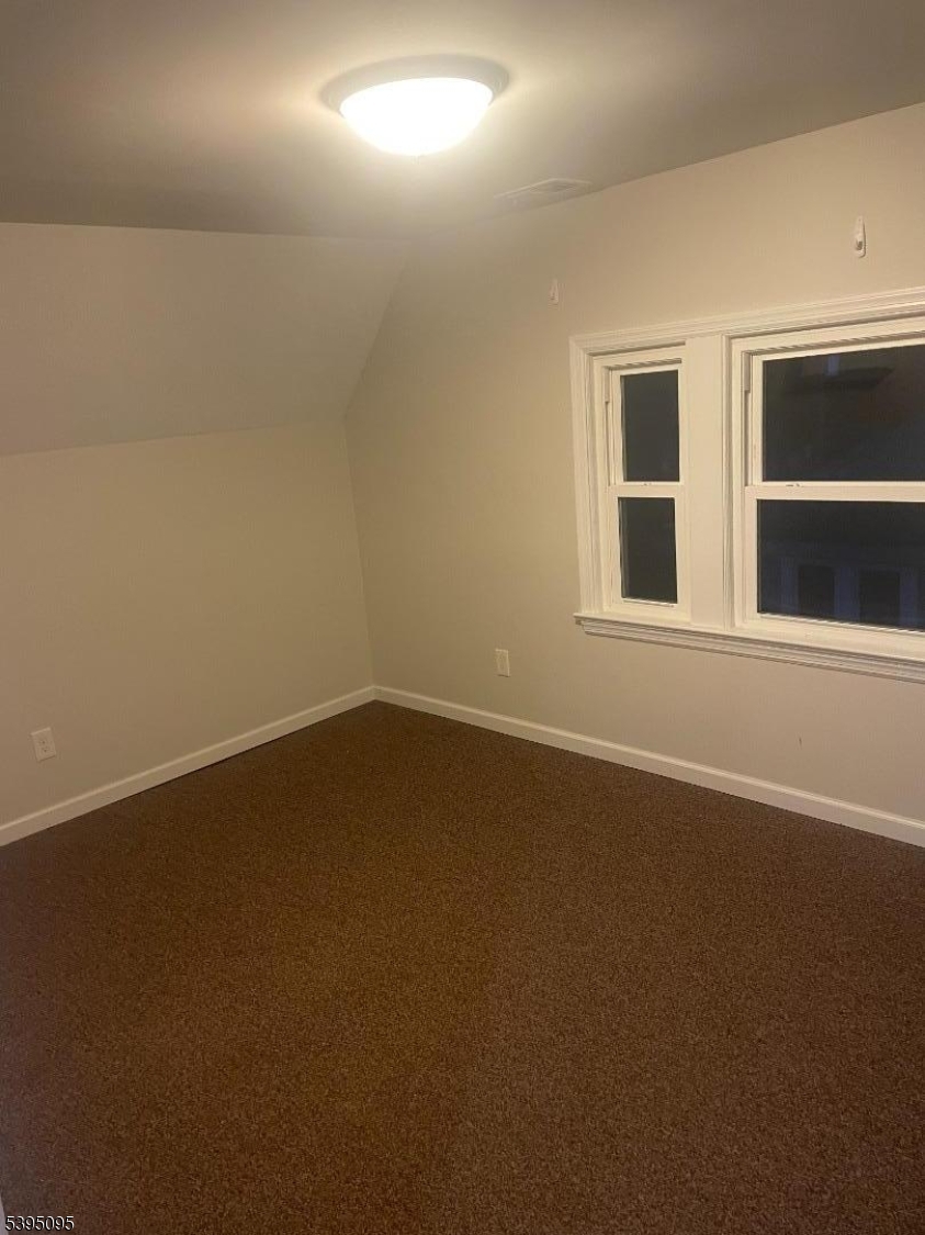 38 Morris Avenue, Unit 3 Springfield, NJ 07081 - Photo 6 of 12 a view of an empty room with a window