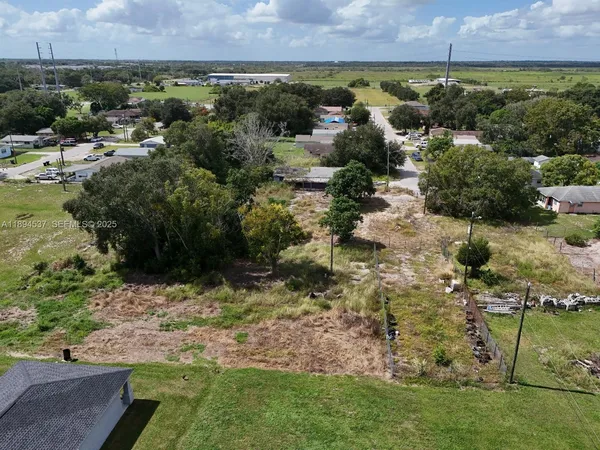 an aerial view of residential house with outdoor space