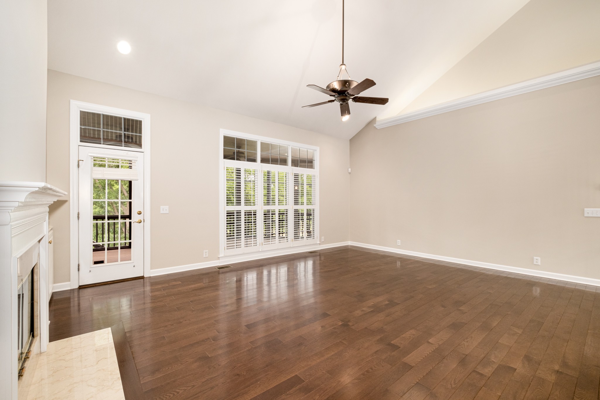229 Gillette Drive Franklin, TN 37069 - Photo 14 of 47 a view of an empty room with a window and wooden floor
