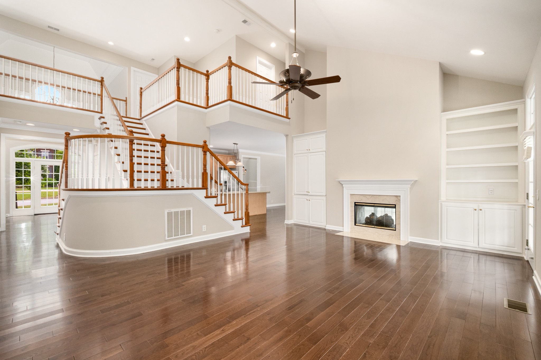 229 Gillette Drive Franklin, TN 37069 - Photo 15 of 47 a view of a room with wooden floor and staircase