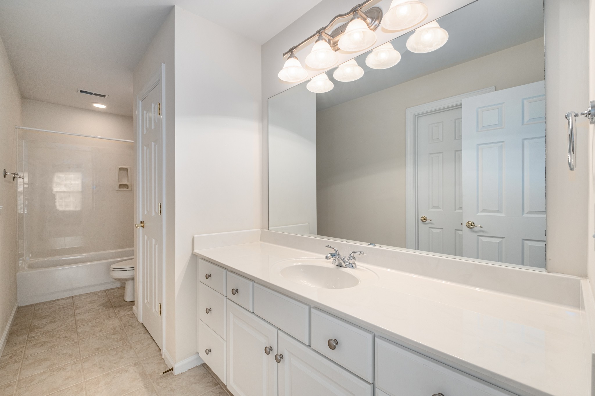 229 Gillette Drive Franklin, TN 37069 - Photo 25 of 47 a bathroom with a sink a toilet and a large mirror