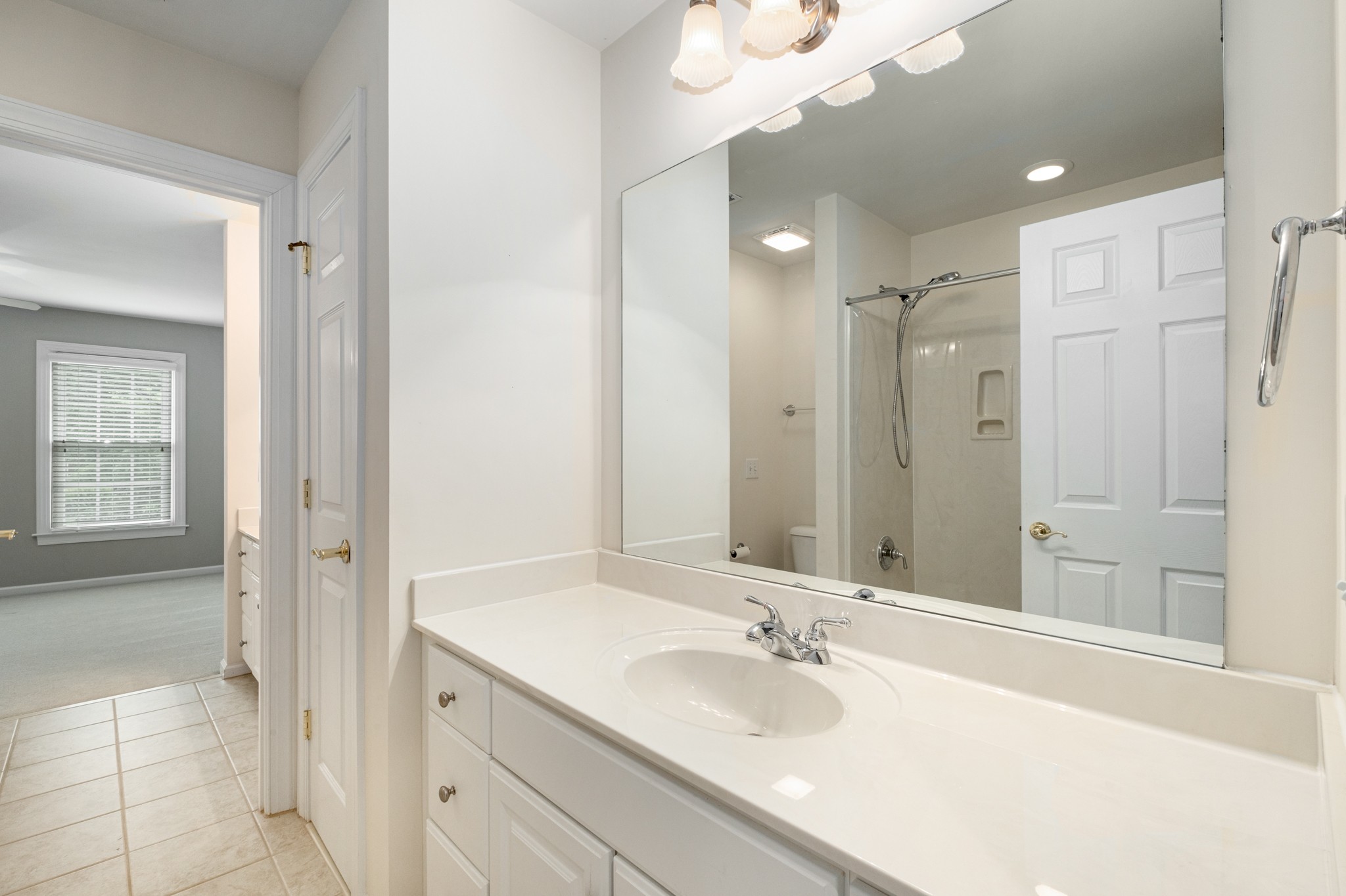 229 Gillette Drive Franklin, TN 37069 - Photo 28 of 47 a bathroom with a granite countertop double vanity sink mirror and shower