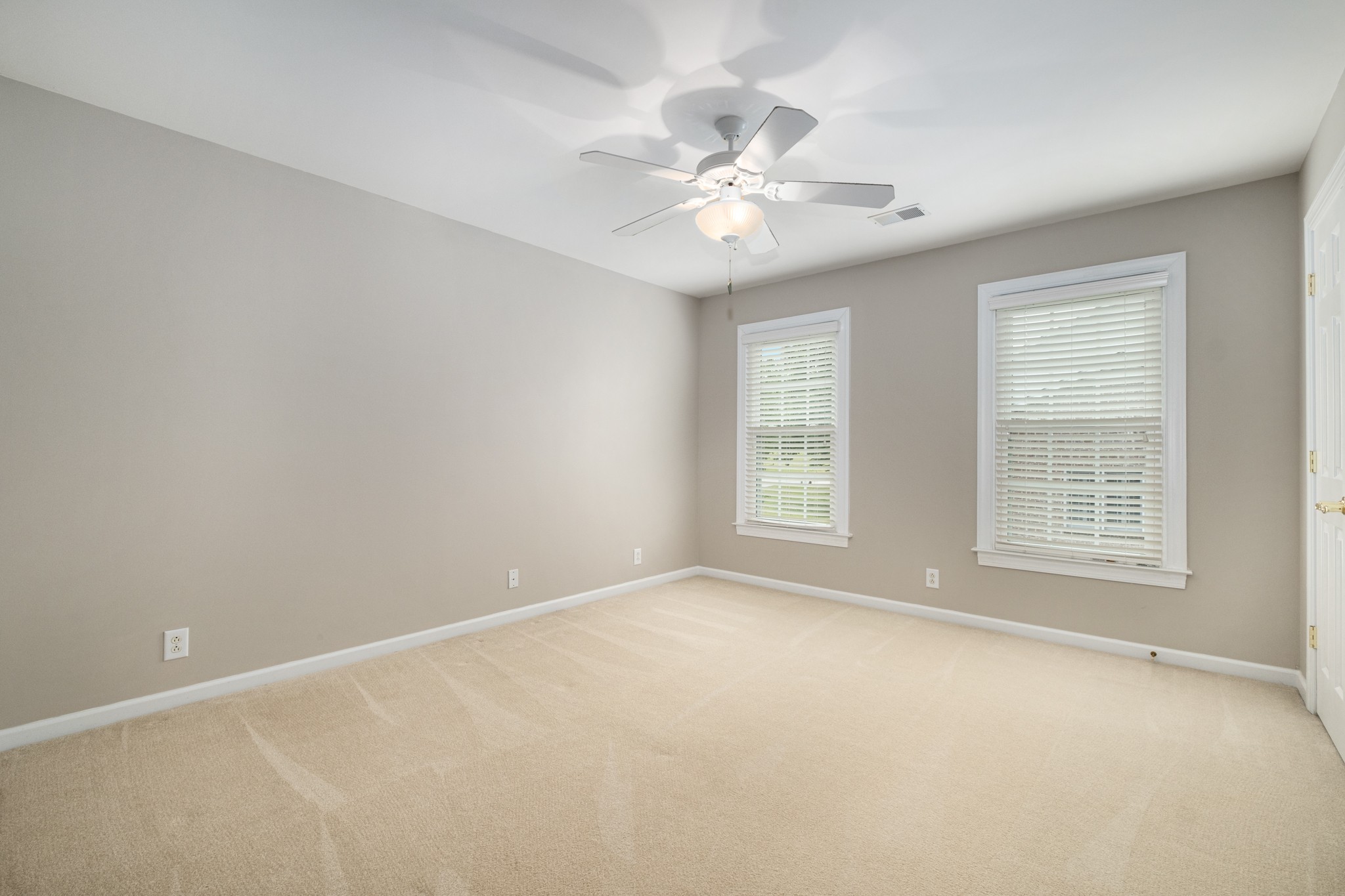 229 Gillette Drive Franklin, TN 37069 - Photo 34 of 47 an empty room with chandelier fan and windows