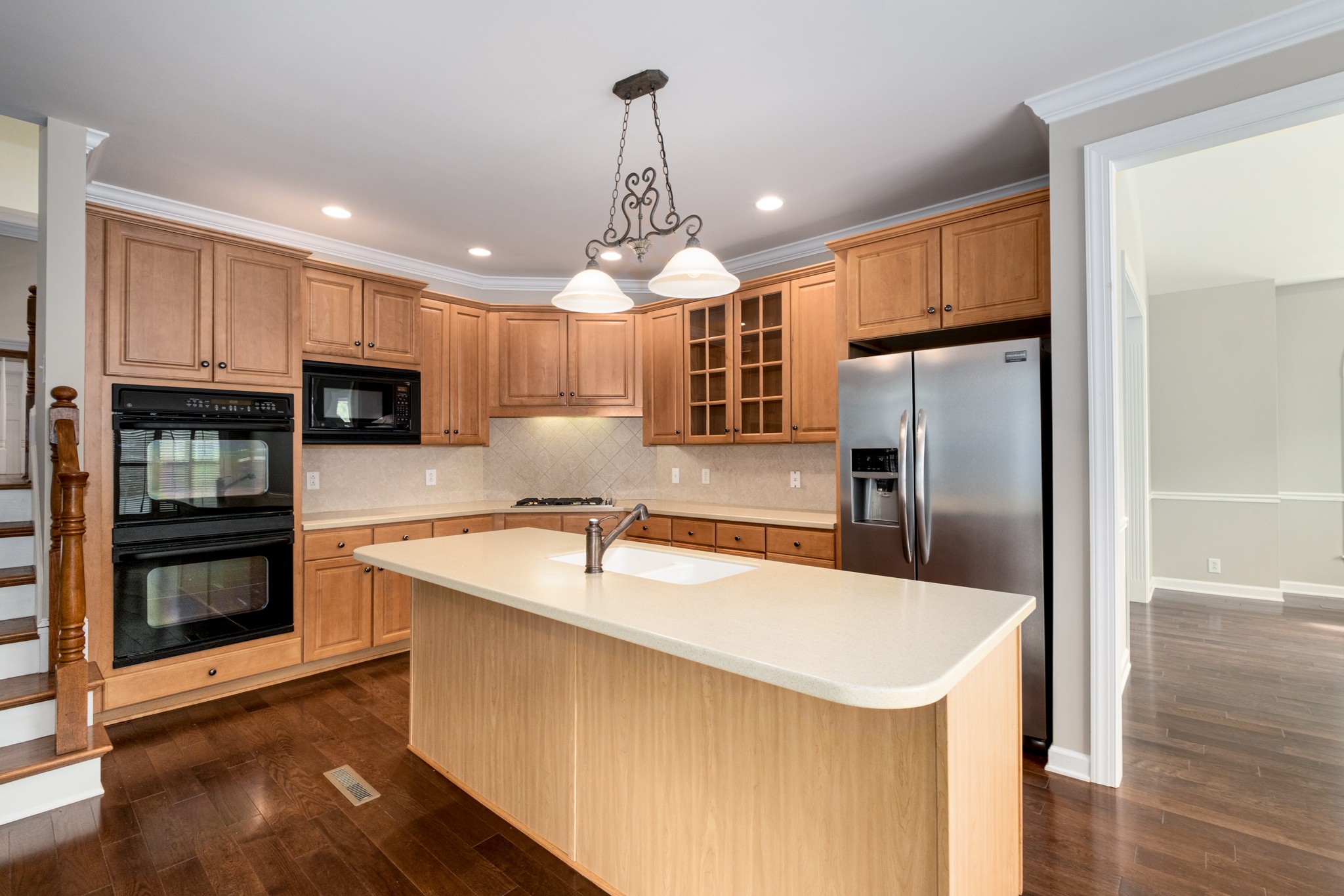 229 Gillette Drive Franklin, TN 37069 - Photo 5 of 47 a kitchen with stainless steel appliances granite countertop a sink a stove and a refrigerator