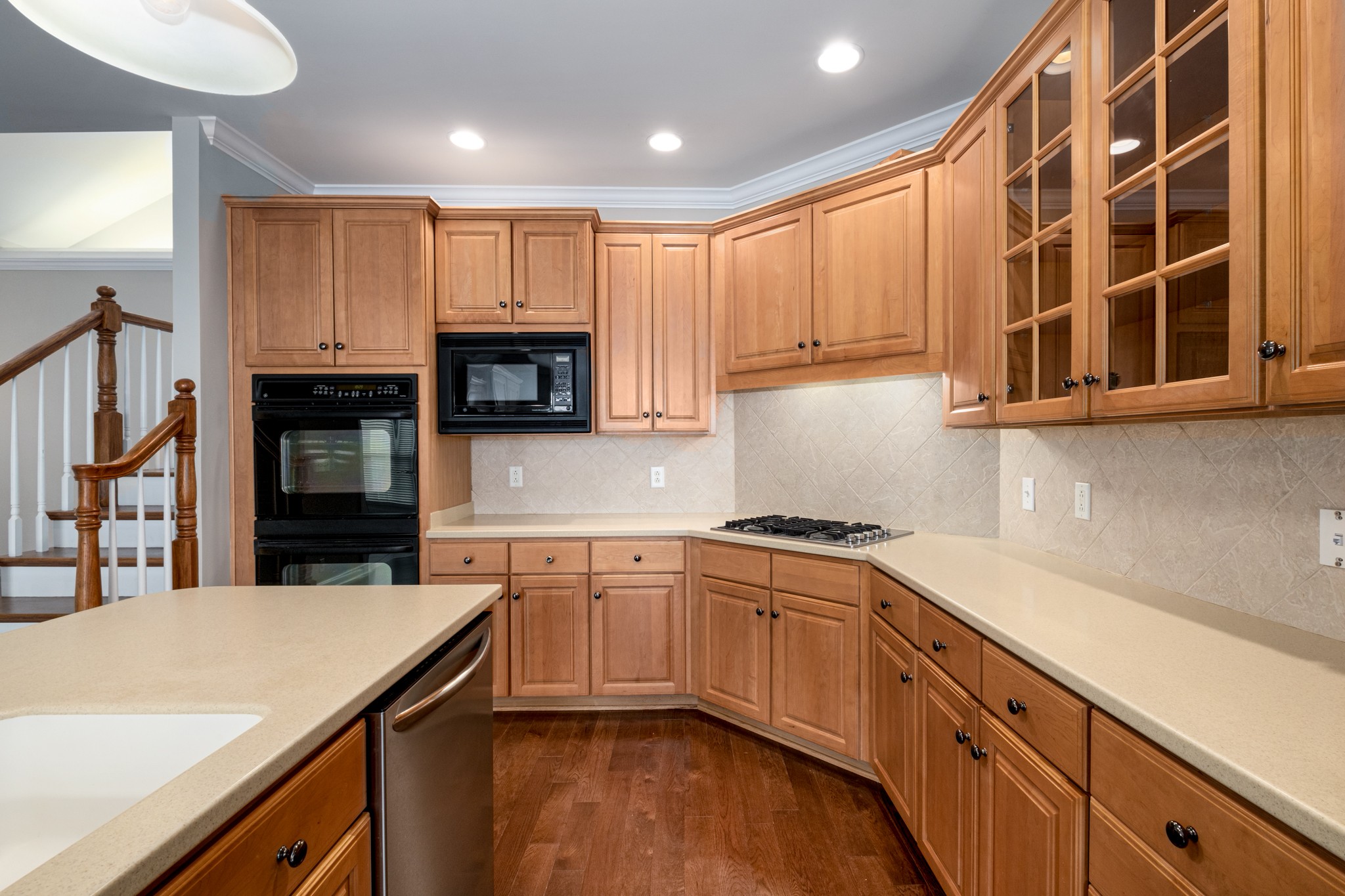 229 Gillette Drive Franklin, TN 37069 - Photo 6 of 47 a kitchen with stainless steel appliances granite countertop a stove a sink and a microwave