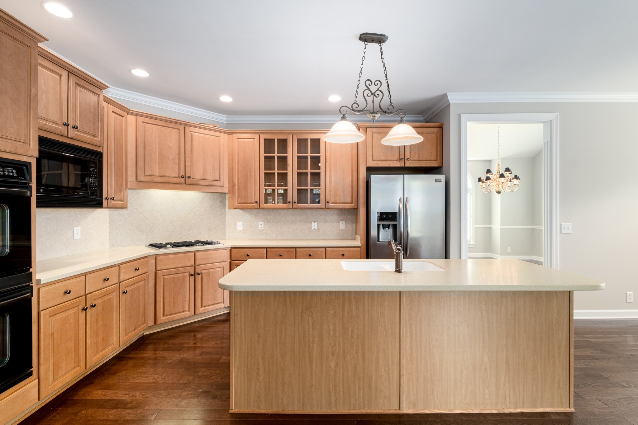 229 Gillette Drive Franklin, TN 37069 - Photo 8 of 47 a kitchen with kitchen island granite countertop a stove and a sink