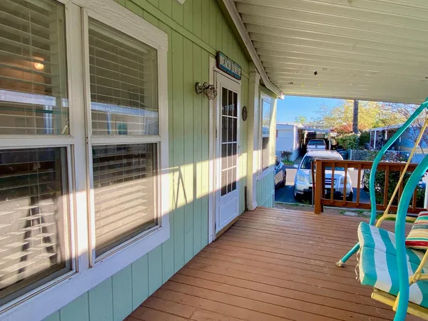 a view of a balcony with chairs