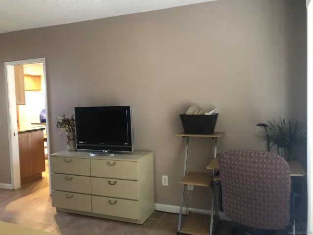 a room with furniture and flat screen tv