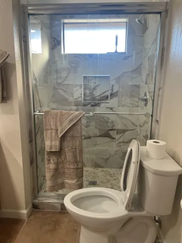 a bathroom with a toilet and a sink