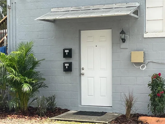 a bathroom with a potted plant
