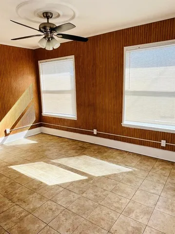 a view of a livingroom with a lounge chair
