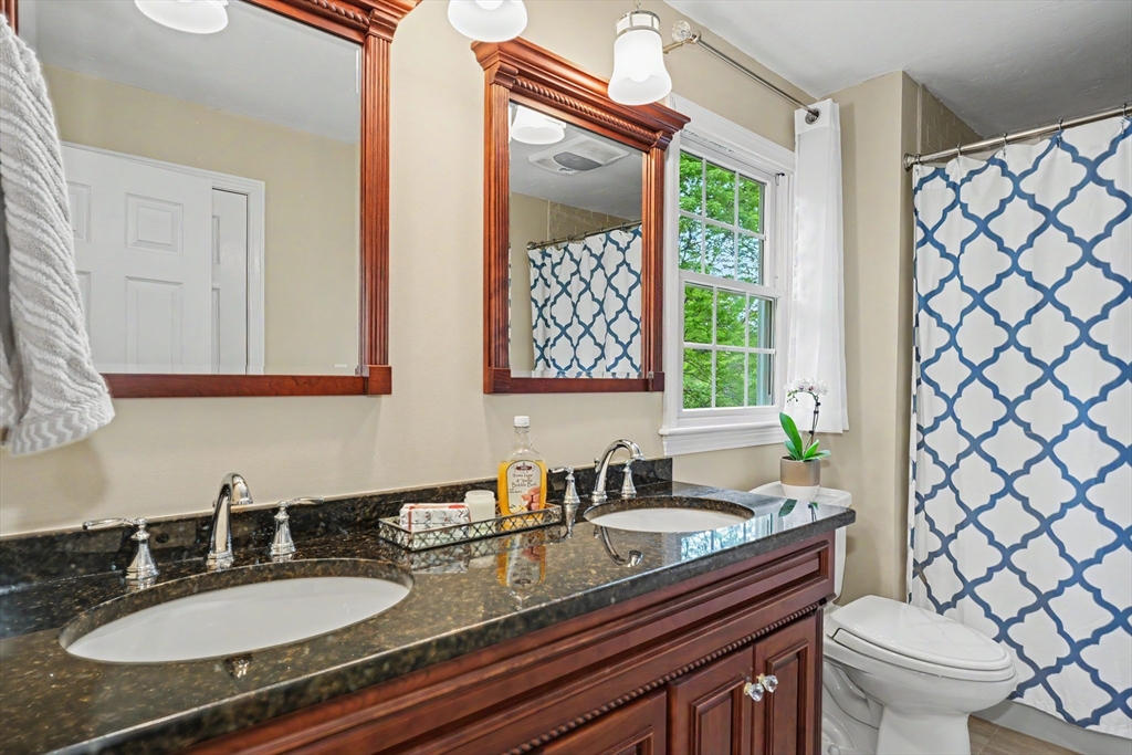 15 Lanthorn Road Northborough, MA 01532 - Photo 22 of 37 a bathroom with a granite countertop sink mirror vanity and toilet