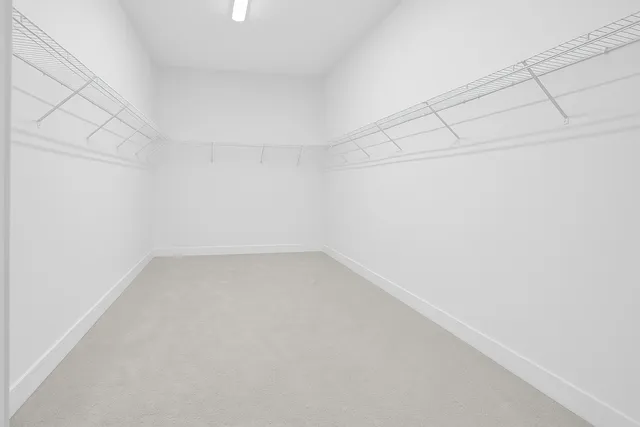 a bathroom with a bathtub sink and mirror