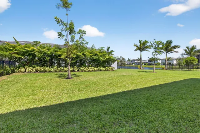 an aerial view of multiple houses with yard