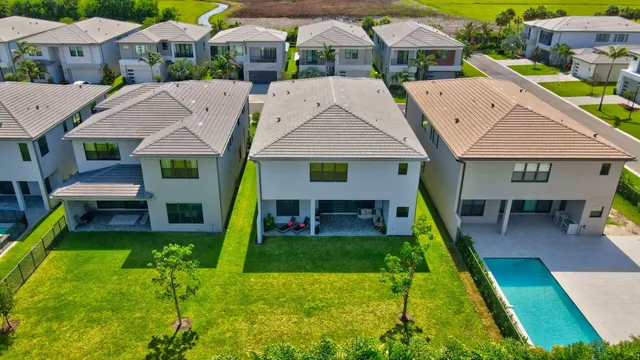 an aerial view of a houses with outdoor space and street view