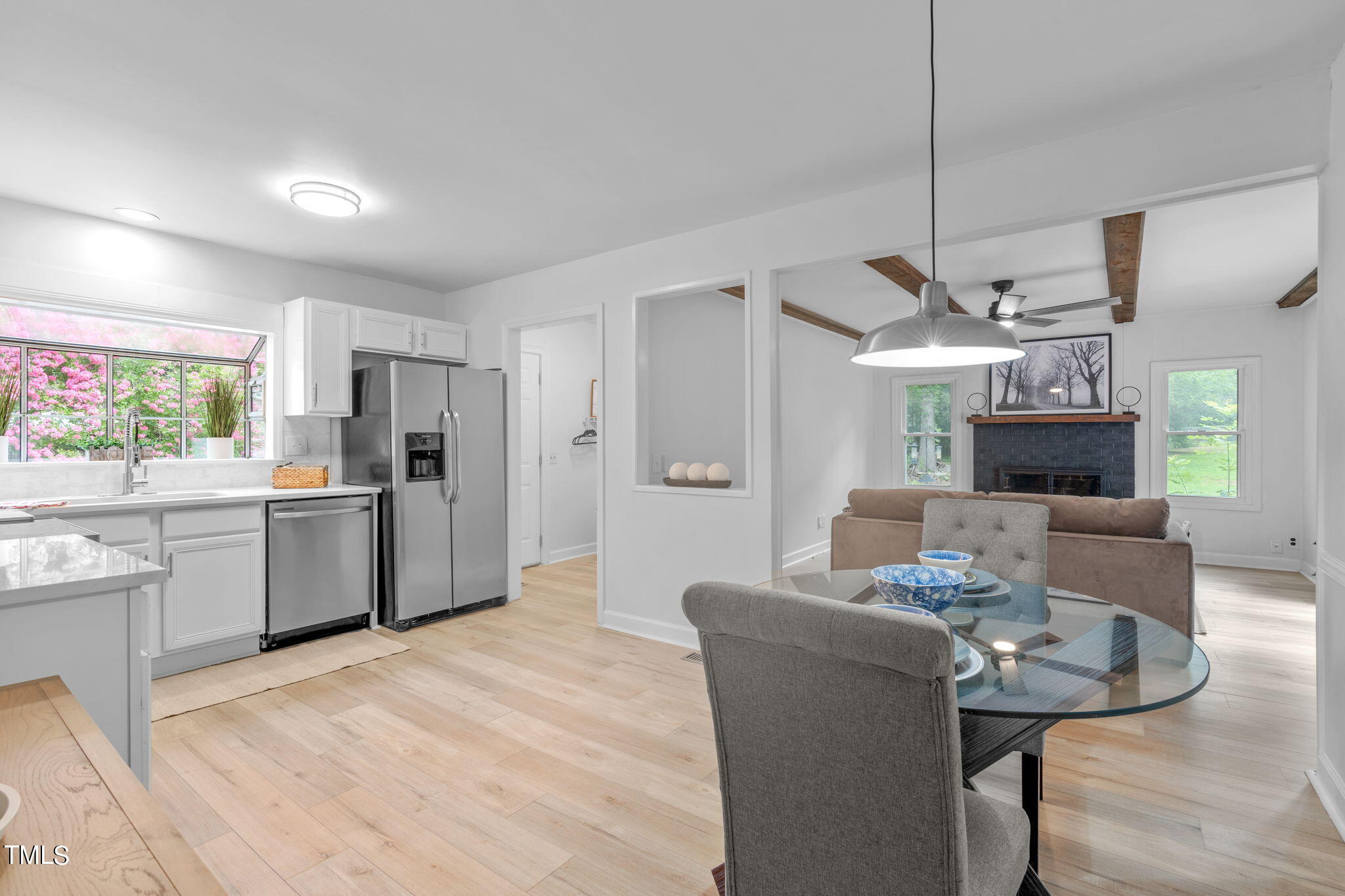 5805 Shamrock Road Durham, NC 27713 - Photo 6 of 19 a living room with stainless steel appliances kitchen island granite countertop furniture and a kitchen view