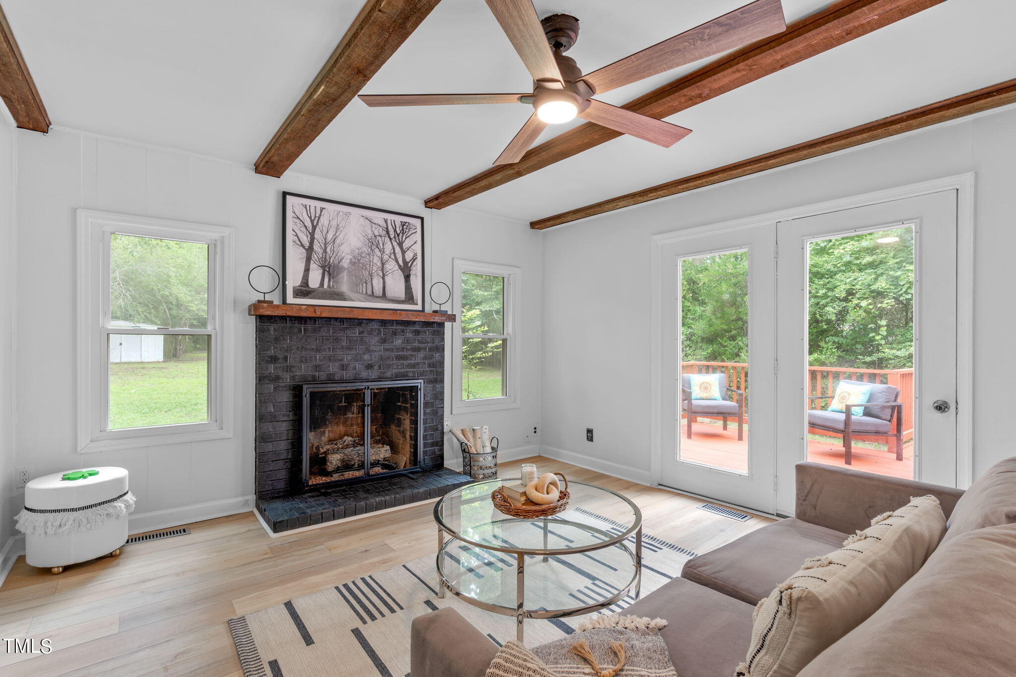 5805 Shamrock Road Durham, NC 27713 - Photo 8 of 19 a living room with furniture and a fireplace