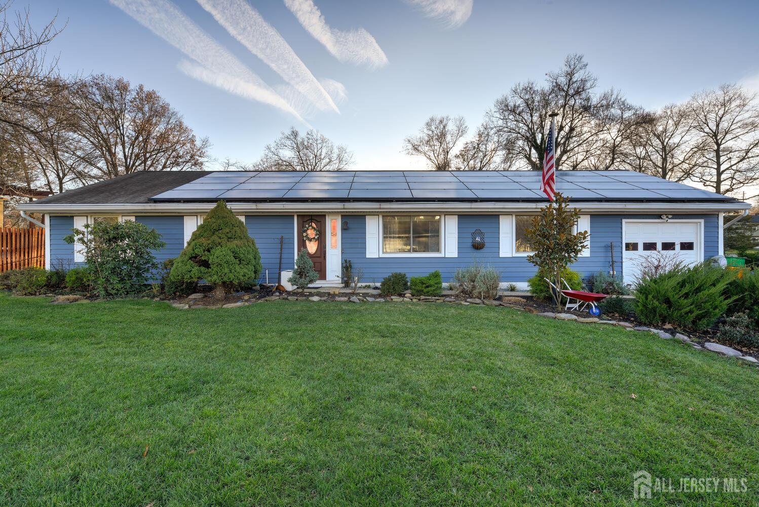 a view of a house with a backyard