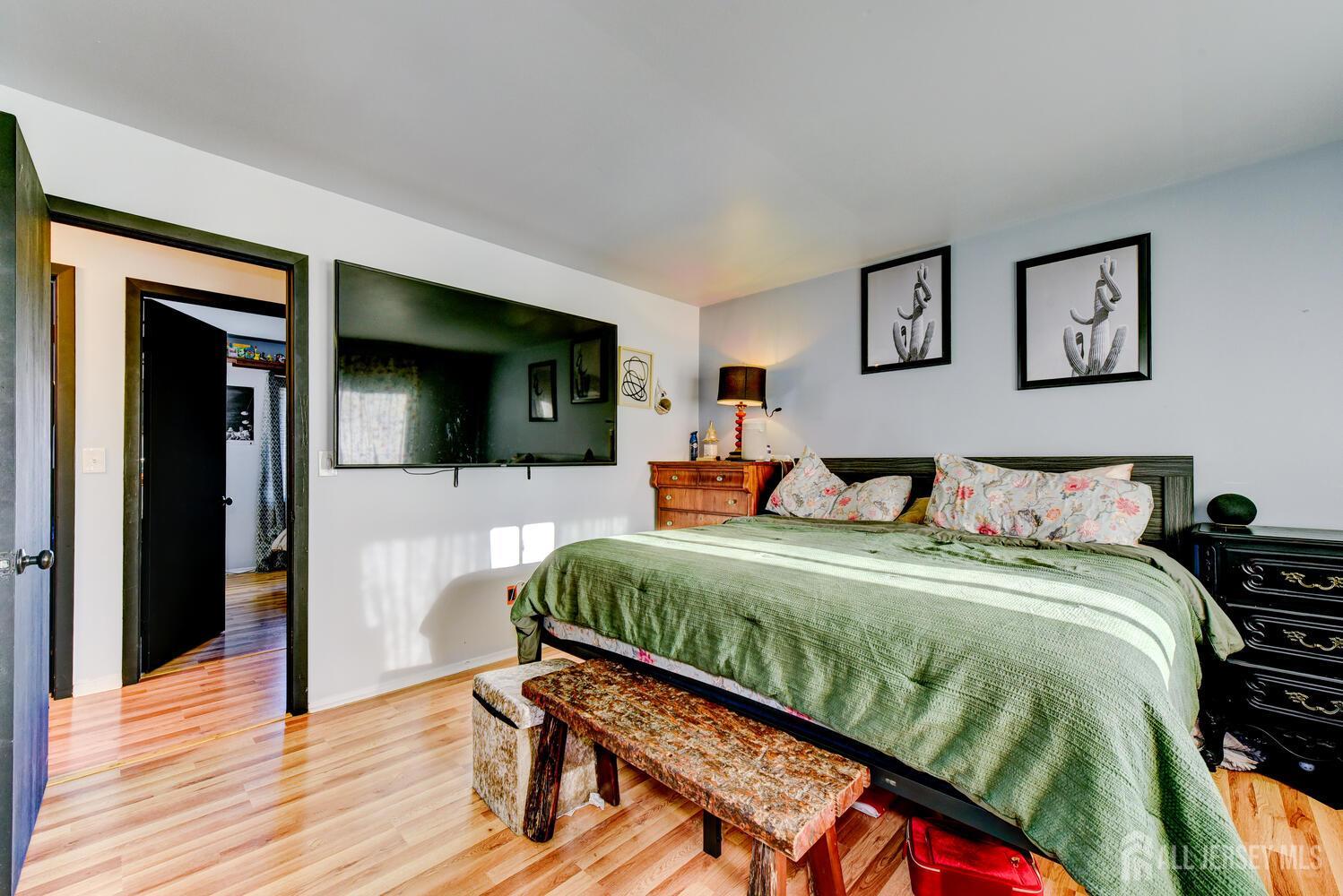 88 Stratton Street South Piscataway, NJ 08854 - Photo 14 of 28 a bedroom with a bed and a flat screen tv