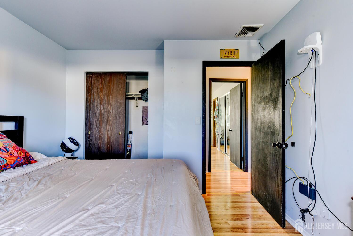 88 Stratton Street South Piscataway, NJ 08854 - Photo 17 of 28 a bedroom with a bed and a mirror