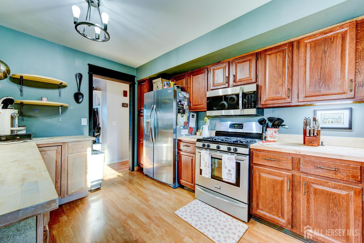 88 Stratton Street South Piscataway, NJ 08854 - Photo 7 of 28 a kitchen with stainless steel appliances granite countertop a refrigerator a stove top oven a sink and dishwasher