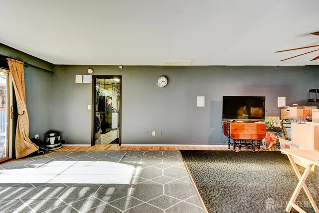 a bedroom with bed and window