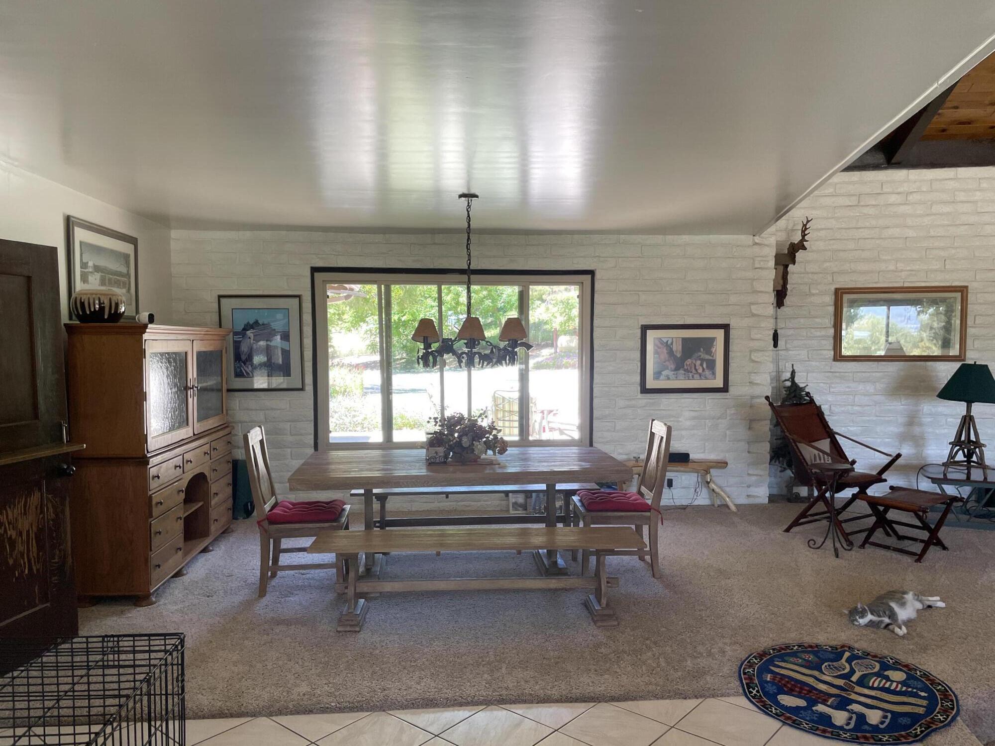 38540 Alva Drive Cherry Valley, CA 92223 - Photo 13 of 60 a living room with furniture a window and a fireplace