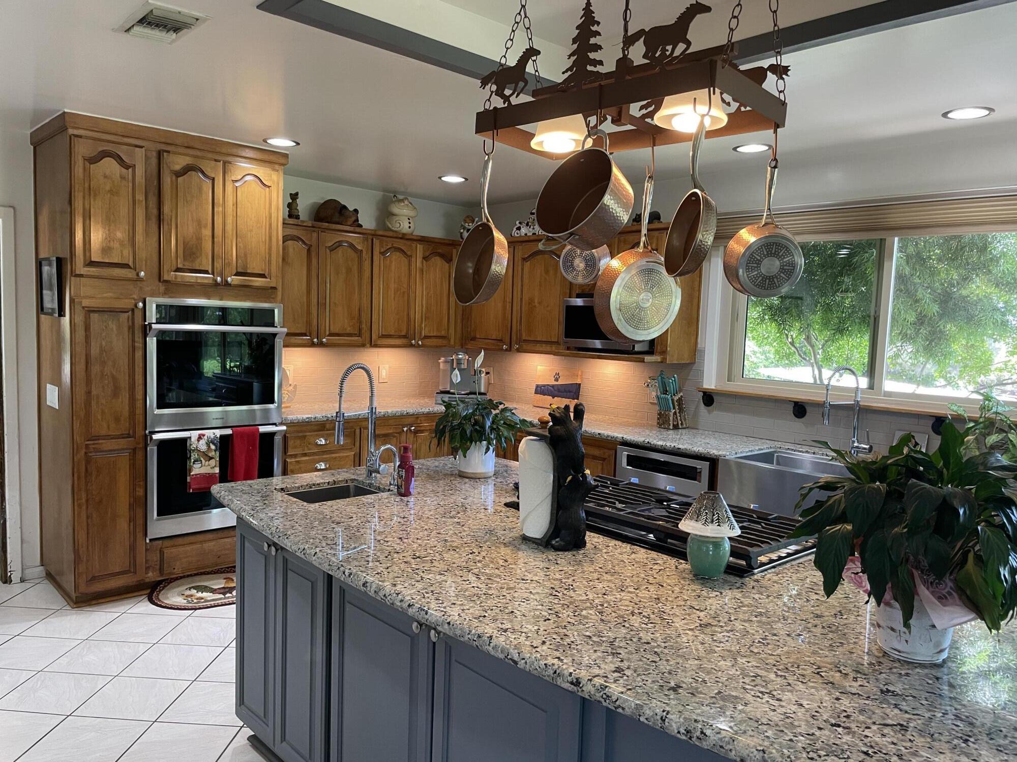 38540 Alva Drive Cherry Valley, CA 92223 - Photo 17 of 60 a kitchen with lots of counter top space