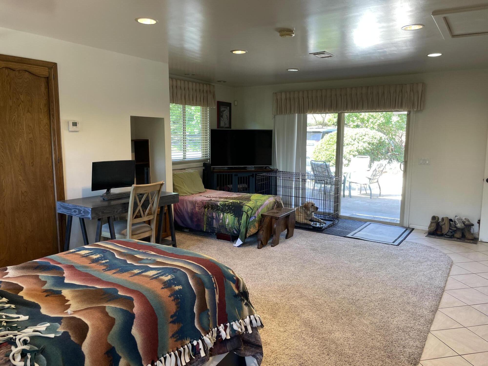 38540 Alva Drive Cherry Valley, CA 92223 - Photo 22 of 60 a bedroom with two beds and a television