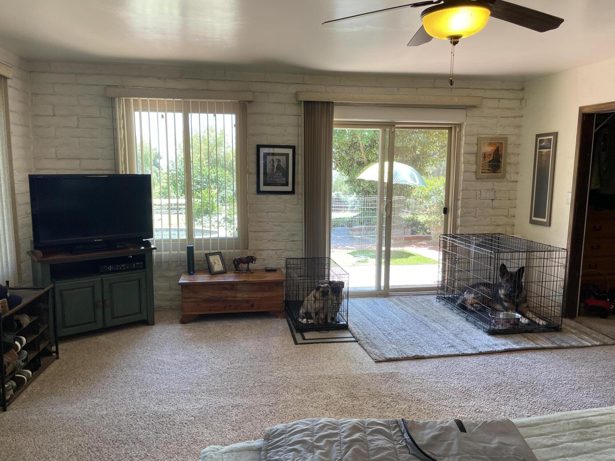 38540 Alva Drive Cherry Valley, CA 92223 - Photo 27 of 60 a living room with furniture and a flat screen tv