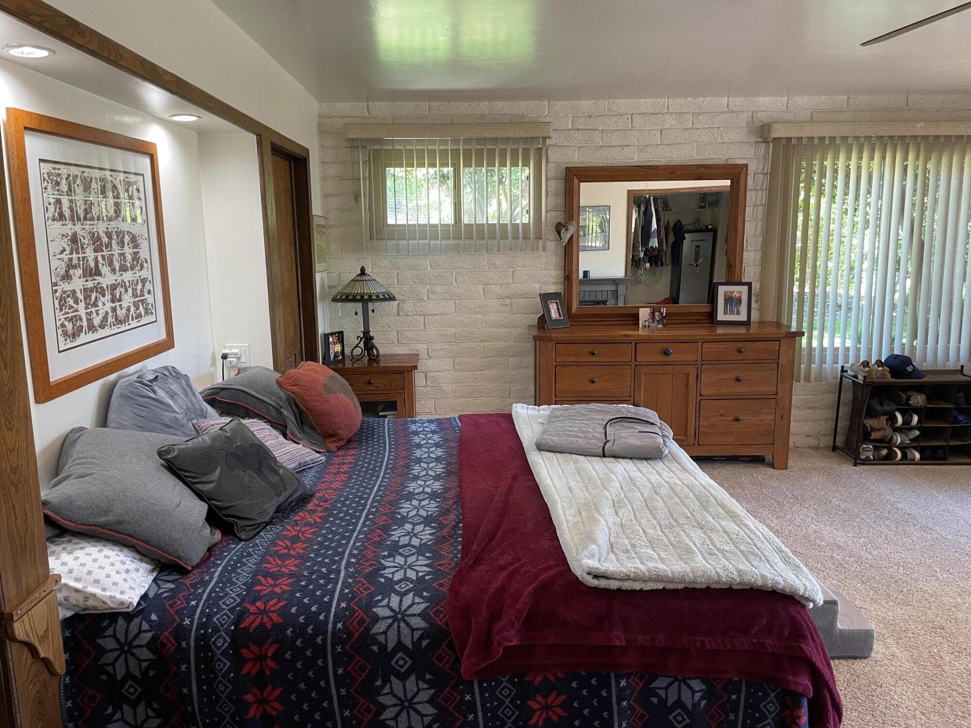 38540 Alva Drive Cherry Valley, CA 92223 - Photo 28 of 60 a bedroom with a bed and a mirror on dresser