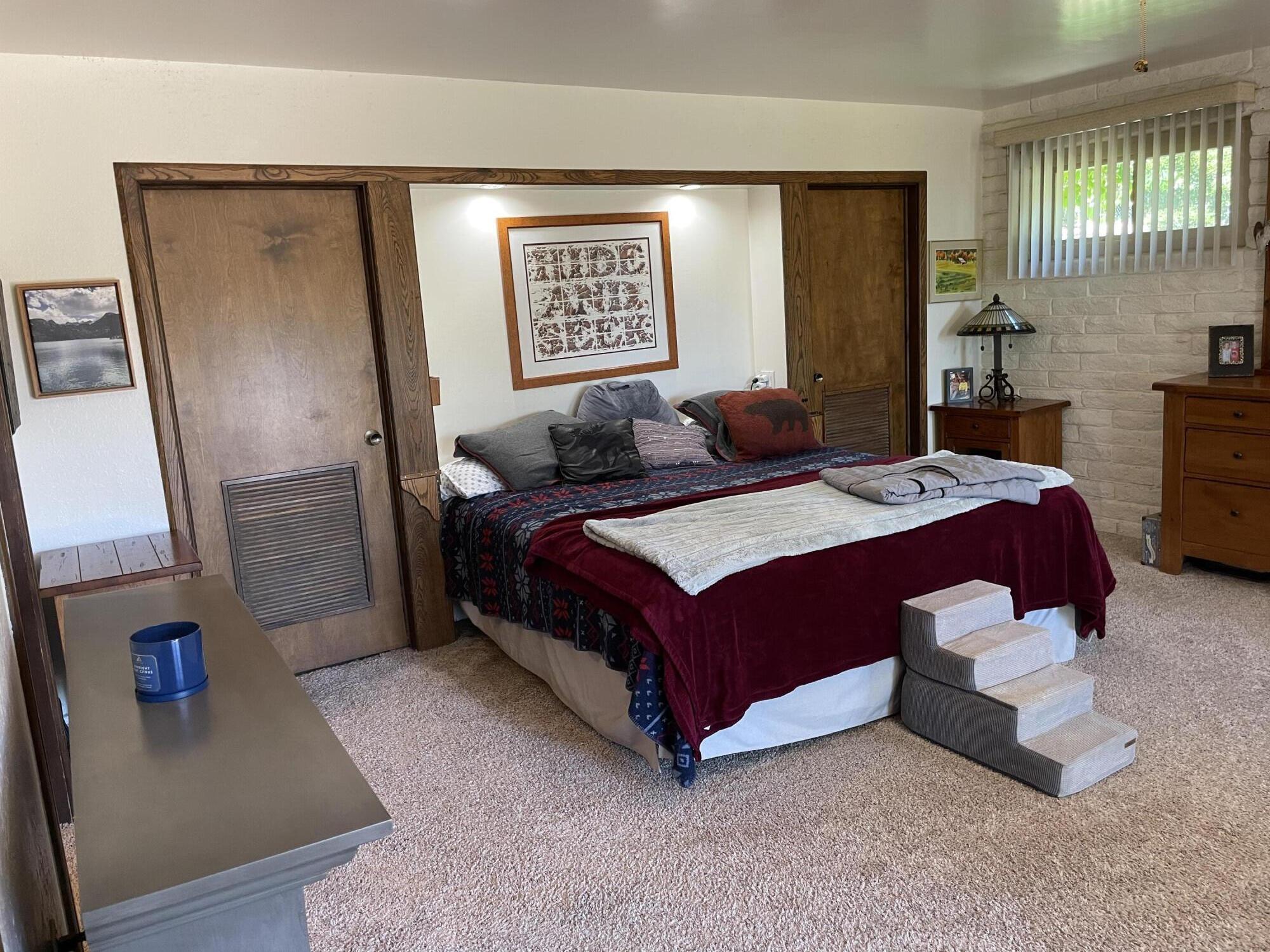 38540 Alva Drive Cherry Valley, CA 92223 - Photo 29 of 60 a bed sitting in a spacious bedroom next to a window