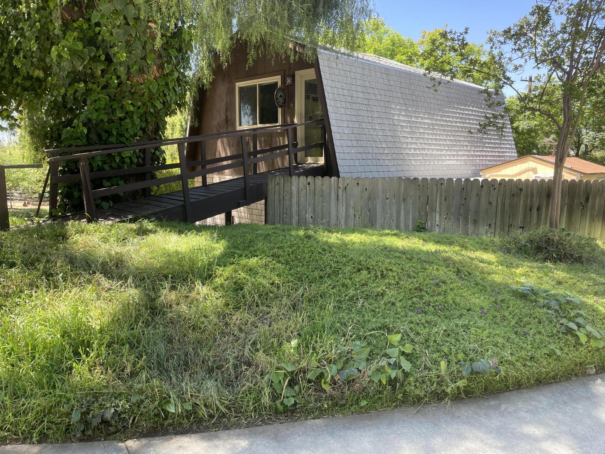 38540 Alva Drive Cherry Valley, CA 92223 - Photo 30 of 60 a backyard of a house with lots of green space