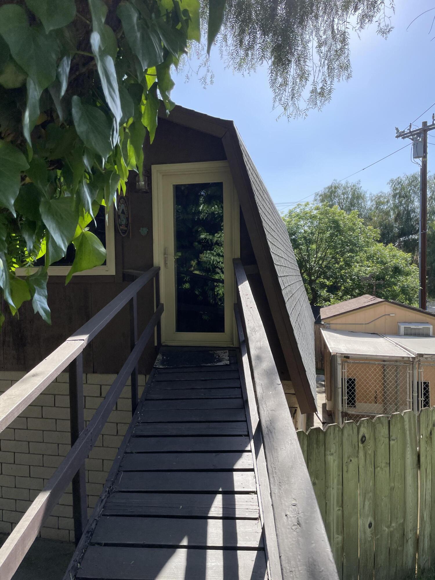 38540 Alva Drive Cherry Valley, CA 92223 - Photo 31 of 60 a view of a house with backyard and deck